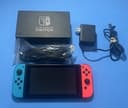 Nintendo Switch with Neon Blue and Neon Red Joy Con Bundle Complete