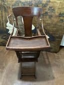 Antique rocking/high chair. Beautiful piece the grandchildren will look great on
